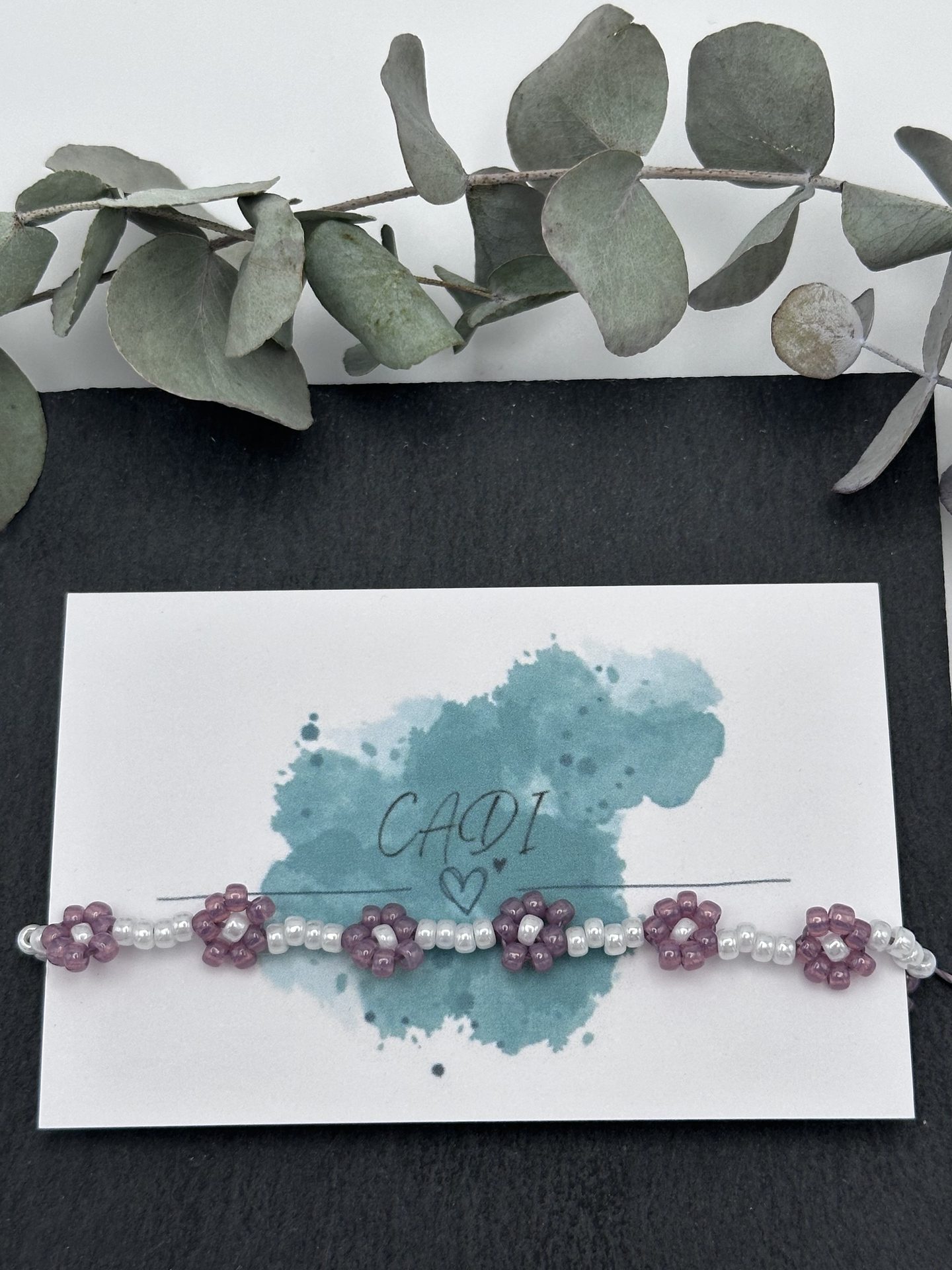Blumenarmband in violett von CADI aus Klagenfurt Blossom